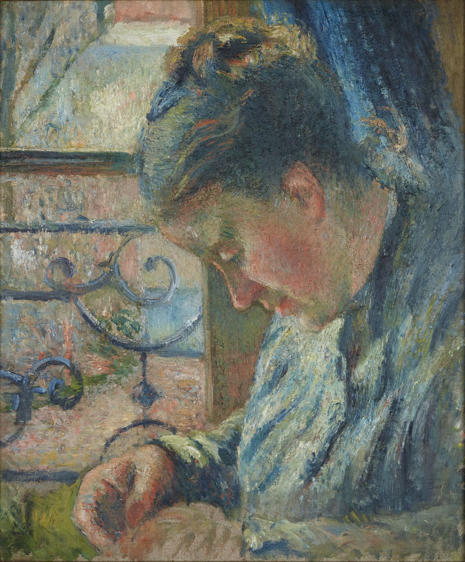 The artist shows his wife Julie working on her sewing.