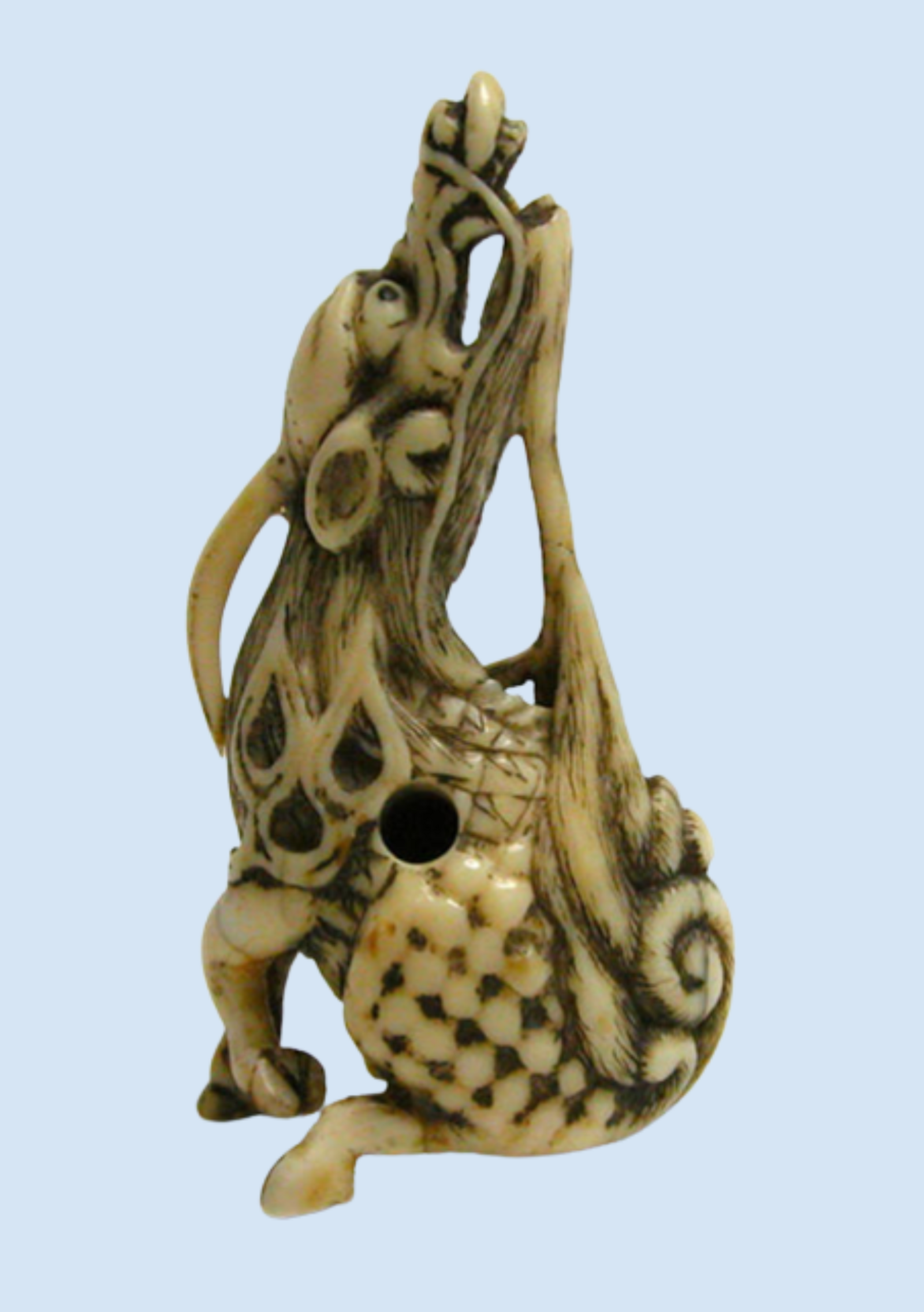 The Japanese  kirin : an ivory unicorn as a good-luck charm.