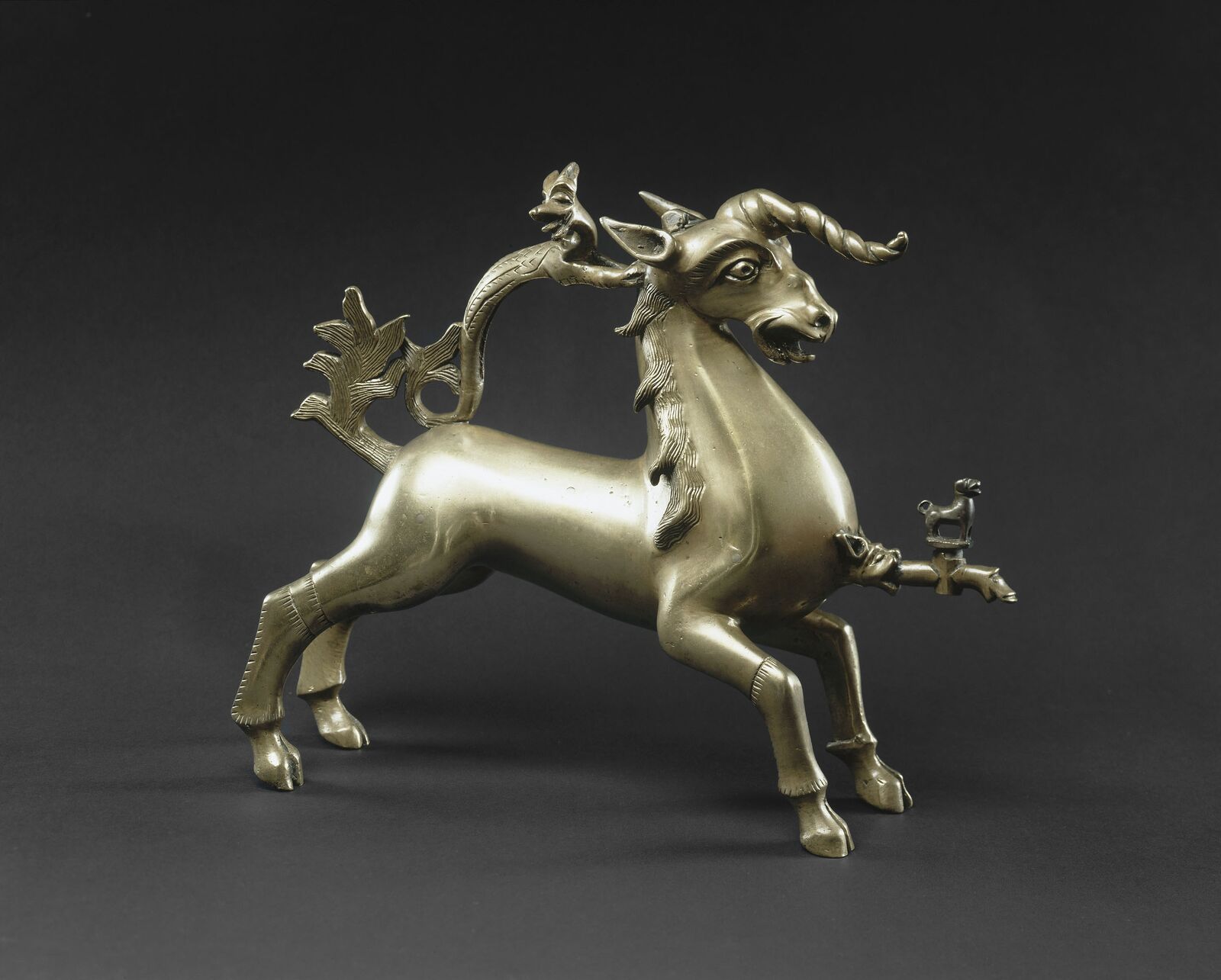 Flaming tail and shaggy mane: a pouring vessel for ritual handwashing.